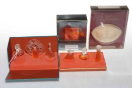 Collection of three boxed Lalique perfumes and Lalique Le Baiser soap (4).