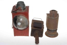 Three railway coach lamps.