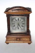 German walnut mantel clock with striking movement, 27cm.