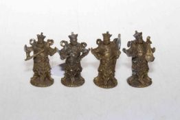 Four small Chinese metal figures, 6.5cm high.