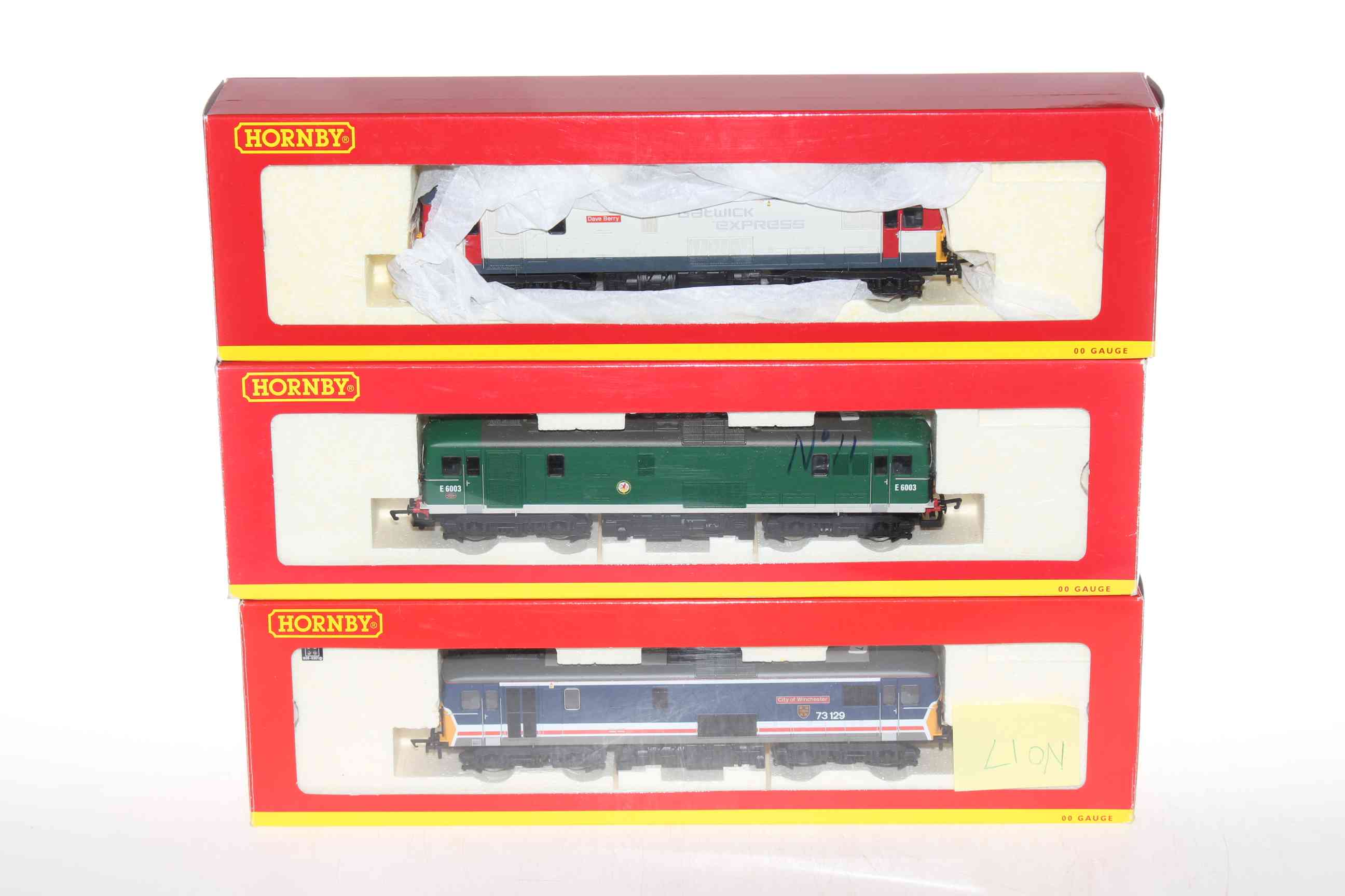 Three Hornby locomotives 'Gatwick Express', two Bo Bo Diesels City of Winchester 73129 and E6003.