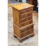 Yew and mahogany eight drawer glove chest, 77cm by 38cm by 28cm.