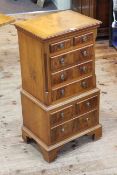 Yew and mahogany eight drawer glove chest, 77cm by 38cm by 28cm.