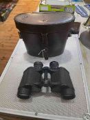 Pair of German Busch binoculars in a 1934 dated leather case.