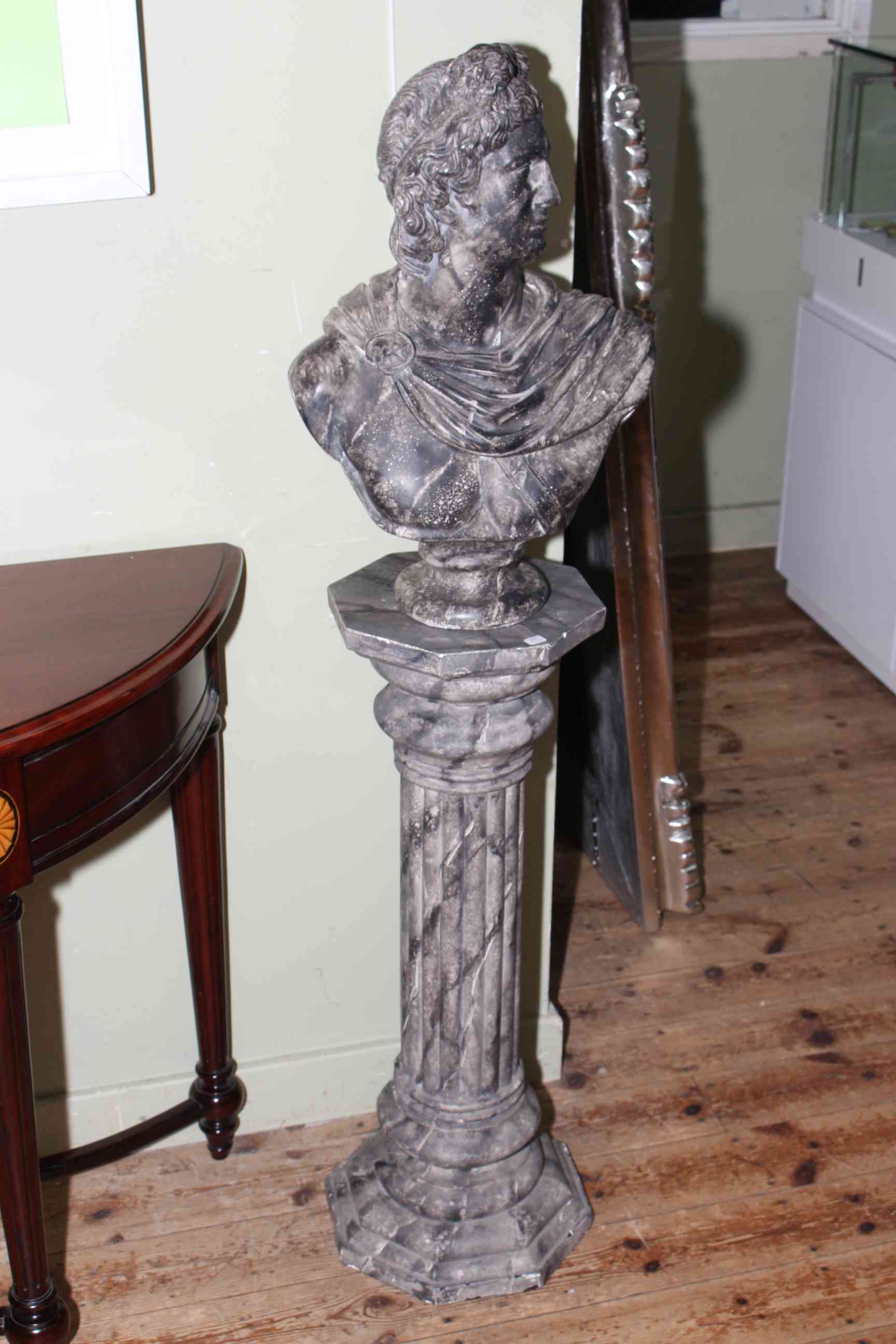 Marble style bust and stand depicting Greek Warrior, 130cm high.