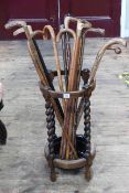 Circular oak barley twist stick stand and collection of walking sticks (stick stand 62cm by 33cm