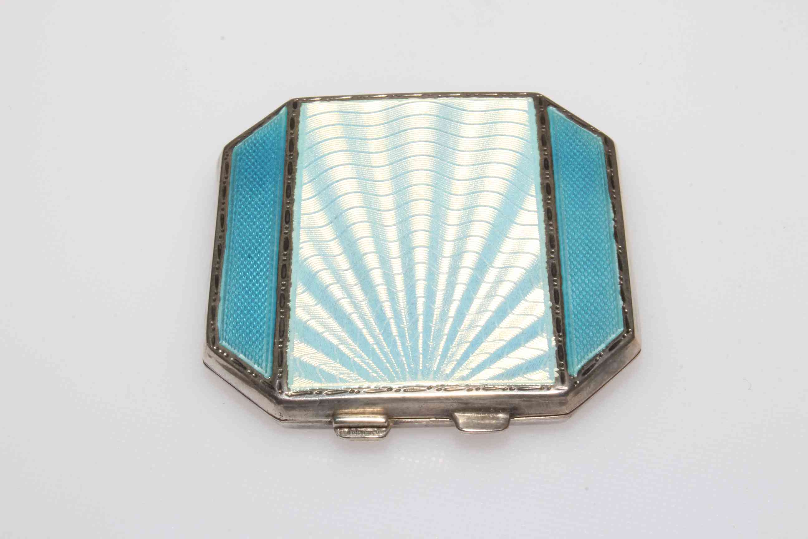Silver and enamel compact with centre panel of shaded blue flanked by blue sides, Birmingham 1947,