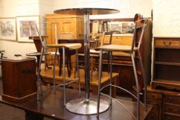 Contemporary circular tinted glass top and tubular bar table and two stools.