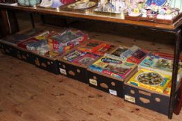 Six boxes of vintage jigsaw puzzles.