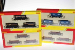 Collection of Hornby OO Gauge railway rolling stock including wagons and tanker wagons.