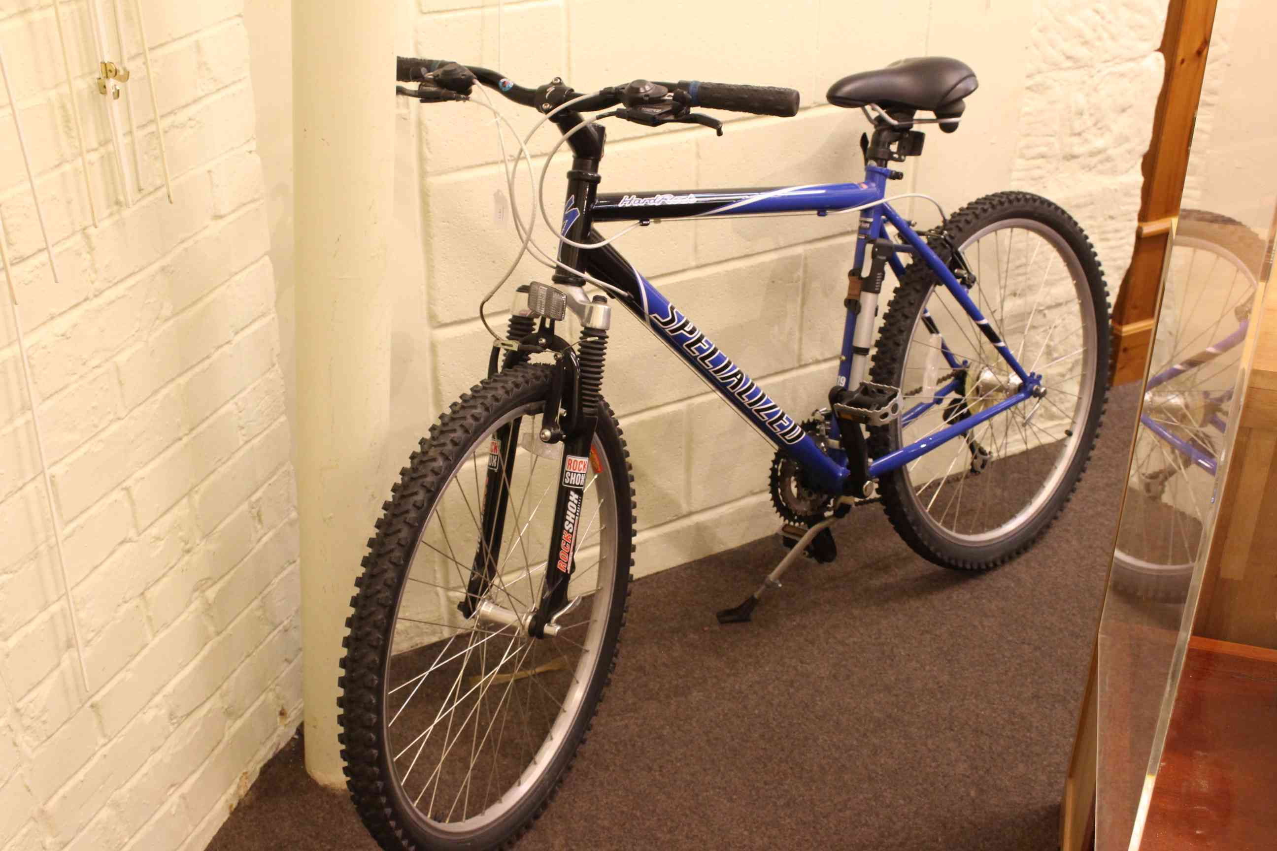 Specialised hard rock mountain bike, with Shimano gears and brakes and Rock Shox front suspension.