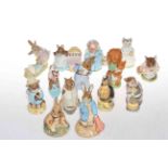 Collection of fourteen Beatrix Potter figures.