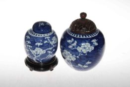 Two Chinese blue and white prunus ginger jars, one with carved lid, 21cm.