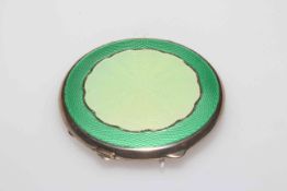 Silver and enamel compact in two colour green, Birmingham 1944, 6.5cm diameter.