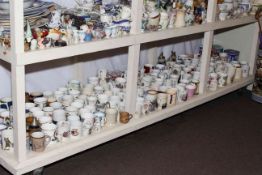 Large collection of commemorative cups.