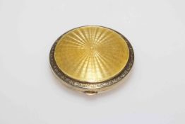Silver and gold guilloché enamel compact with gilt scroll borders, Birmingham 1929, 5.5cm diameter.