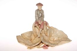 Pottery model of boy on leaves painted HMC mark to base.