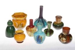 Collection of nine Linthorpe Pottery and other small vases, including shape no. 1225 and 811.