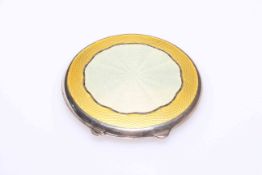 Silver and two colour yellow enamel compact, Birmingham 1946, 7cm diameter.