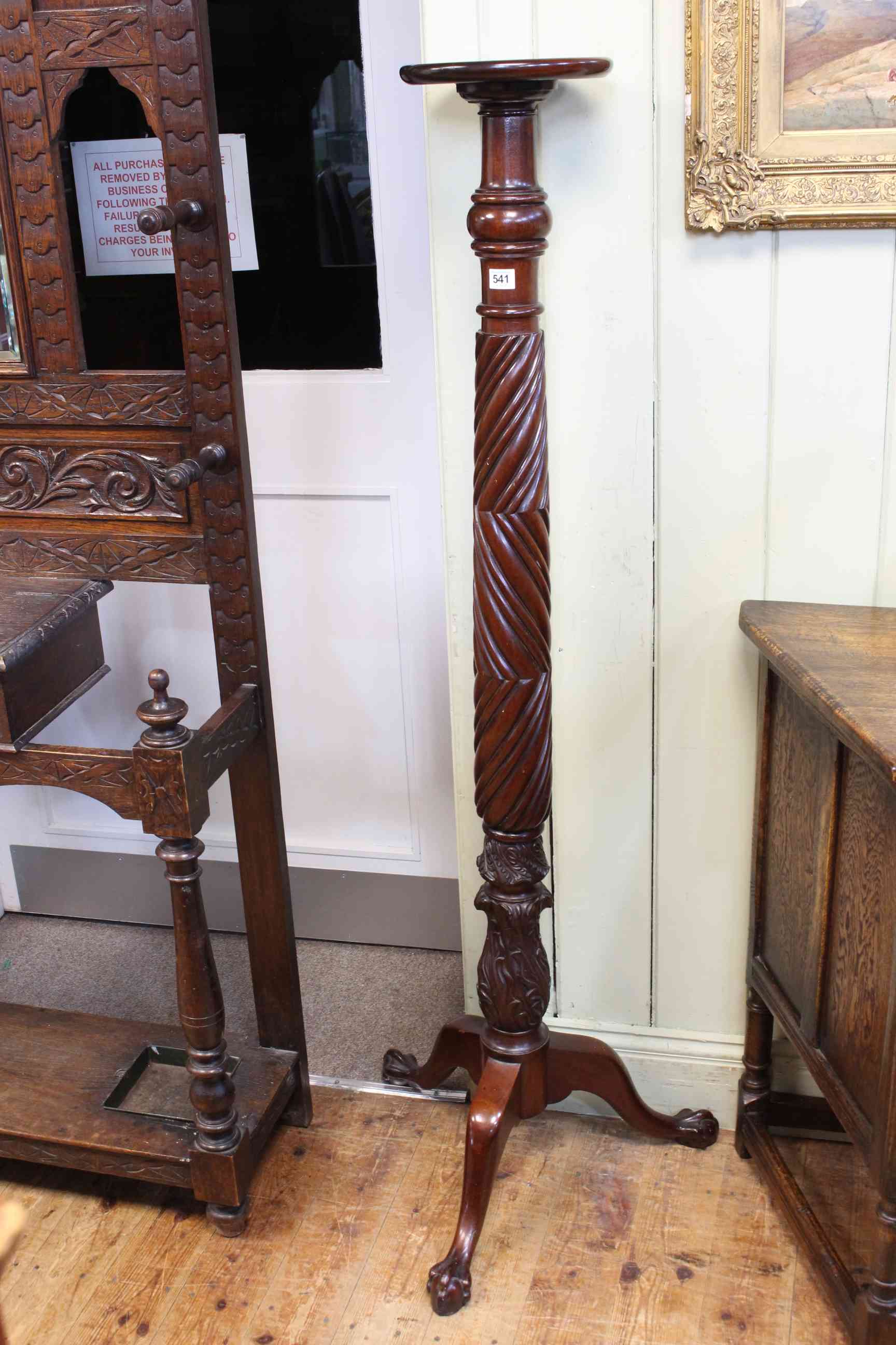 Mahogany twist and carved column tripod torchere on ball and claw feet, 153cm.