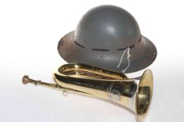 Trumpet and metal helmet.