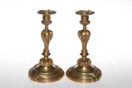 Pair 19th Century gilt bronze candlesticks, 21cm.