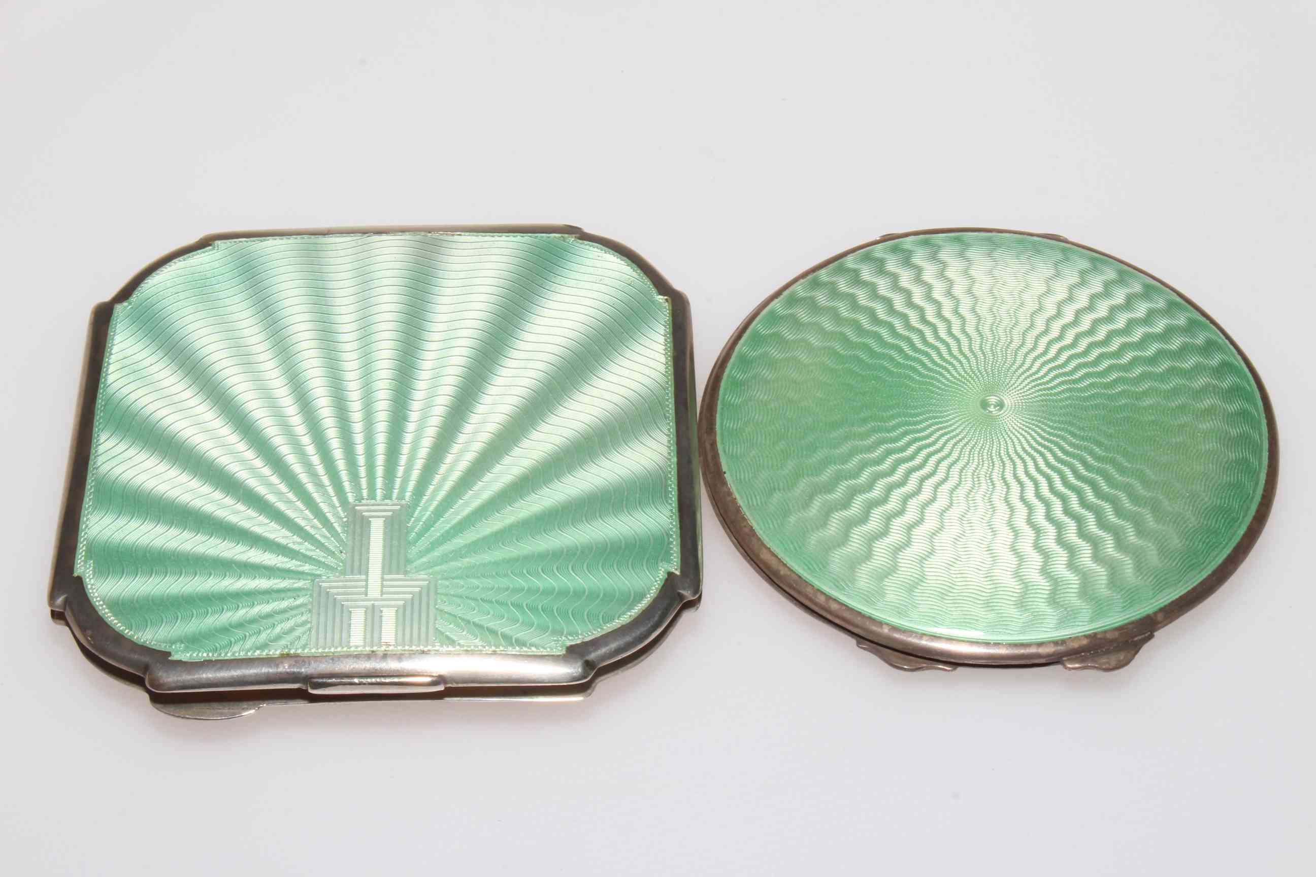 Two silver and pale green enamel compacts, of square form 8.