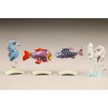 Four assorted Swarovski crystal glass fish and seahorses, with original boxes.