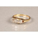 Ladies three stone diamond ring, on yellow metal shank, central stone 0.33 carats, stone either side