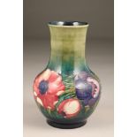 Moorcroft anemone vase, ovoid shape with tall neck, on green ground with impressed marks and green