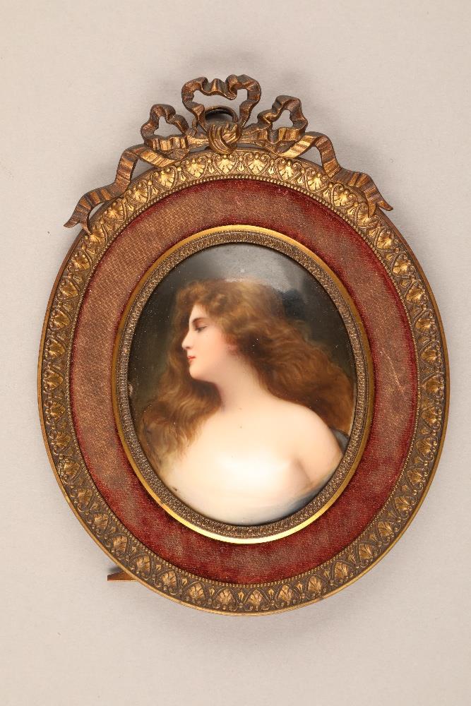 Gilt framed oval miniature, of a young maiden, hand painted on an oval porcelain plaque, unsigned,