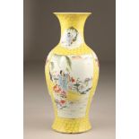 20th century Chinese famille jaune vase, of baluster form decorated with figures in landscapes, 44.