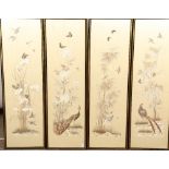 Set of four Japanese framed silk works depicting assorted flowers, bamboo with birds and