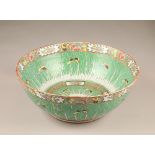 Large 19th/20th century Chinese punch bowl, decorated with cabbage leaves with borders of flowers