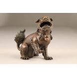 19th century Chinese bronze lion dog censor, with hinged head, 18cm high.