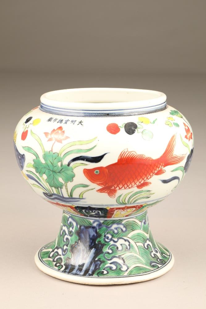 19th/20th century Chinese vase, of globular form on a large circular foot, decorated with carp, 22cm