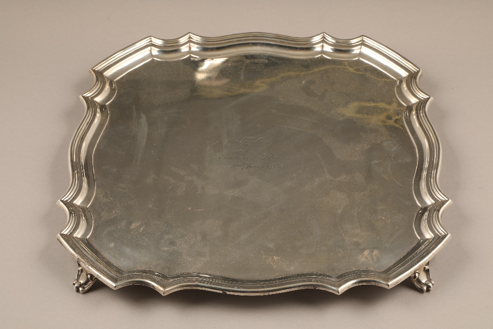 Walker & Hall silver salver, serpentine pie crust edge raised on four scroll feet, assay marked