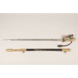 A British naval officers dress sword with shagreen grip and leather scabbard with etched blade, 81cm