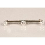 Ladies three stone diamond bar brooch, on 18 carat white gold centre stone 0.75 carats, stone either