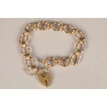Link bracelet, 9 carat gold with heart shaped clasp, weight 25.8g.