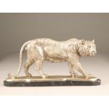 Reproduction silvered bronze figure of a tiger, mounted to a black marble base, 50cm long, 24cm