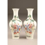 Pair 19th/20th century Chinese vases, of baluster form decorated with children playing with a sword,