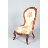 A Victorian walnut parlour chair upholstered in floral fabric, height 100cm.