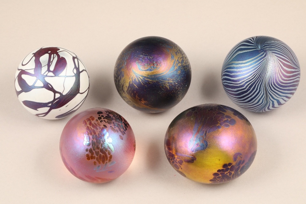 John Ditchfield for Glasform, five assorted iridescent glass paperweights, all etched to base