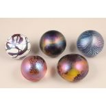 John Ditchfield for Glasform, five assorted iridescent glass paperweights, all etched to base