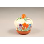 A Clarice Cliff Bizarre crocus pattern preserve pot and cover, with printed mark, 7.5cm high.
