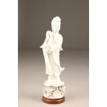 20th century Dehua porcelain (blanc de chine) figure of goddess Guanyin holding a lotus flower