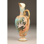 Fine Nautilus porcelain ewer, baluster form with a gilt scroll acanthus leaf handle, painted in