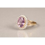 9 carat gold amethyst and diamond cluster ring, central cut amethyst surrounded by 24 diamond chips.
