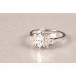 18 carat white gold diamond ring, central 0.4 carat marquise cut diamond flanked on either side by a